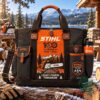 STIHL 100th Anniversary 1926-2026 Tote Bag - front view with printed chainsaw emblem