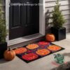 Halloween 2026 Jack-o'-Lantern Pumpkin Patch Doormat - angled front view by a doorway