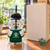 Starbucks Bear Barista Bottle 2026 - front view with green apron and black cap