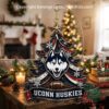 UConn Huskies Christmas tree ornament hanging by a fireplace