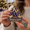 Woman holding the Washington Huskies Christmas ornament
